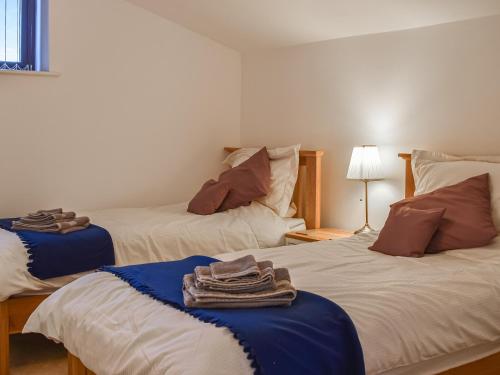 מיטה או מיטות בחדר ב-Fig Tree Barn