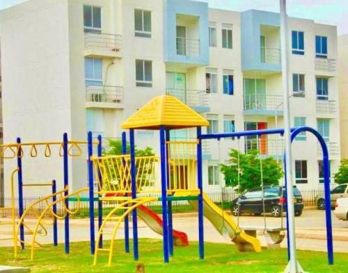 a playground in front of a apartment building at Increible apartamento en vup in Valledupar