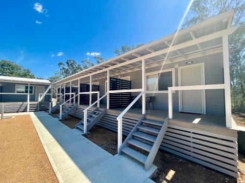 a house with stairs on the front of it at West View Caravanpark in Dubbo