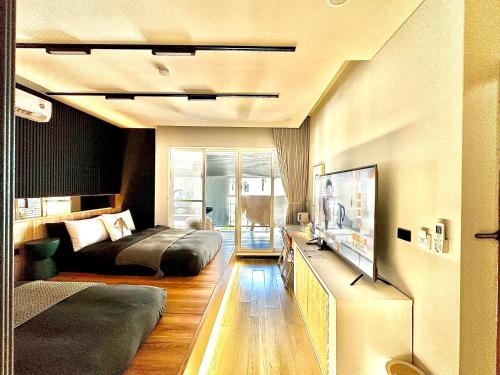 Μια τηλεόραση ή/και κέντρο ψυχαγωγίας στο Here Hotel 宅這兒私宅-墾丁B宅