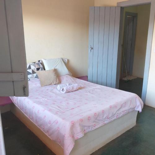 A bed or beds in a room at Casa de Praia