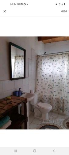 a bathroom with a toilet and a sink at Casa campestre 6 personas in San Antonio