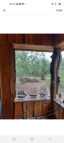a window with a view of a bathroom with sinks at Casa campestre 6 personas in San Antonio