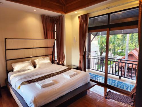 Postel nebo postele na pokoji v ubytování ปุณณภา พูล วิลล่า พัทยา Punnapha Pool Villa Pattaya