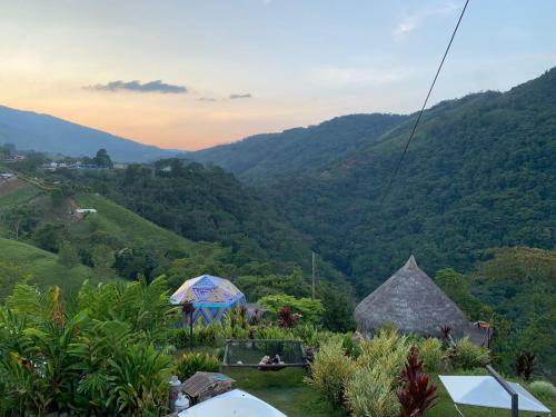 a view of a valley with hills and trees at Glamping San Luis in San Luis