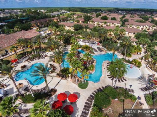 an aerial view of a resort with two pools at Townhouse in Regal Palms Resort, Amenities, Pool & lazy river, Near Disney, Orlando in Davenport