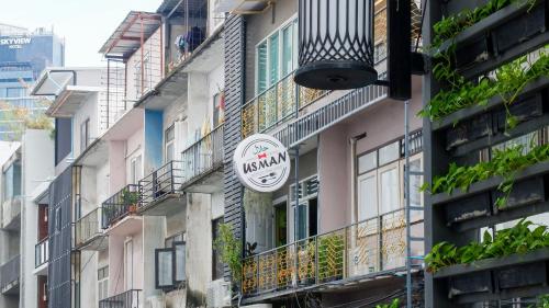 a sign on the side of a building at Usman Halal Home in Bangkok