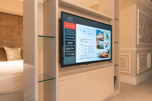 a tv in a wall in a room with a bed at Y11 azabu hotel by Mrt in Tokyo
