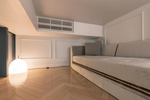 a living room with a couch and a window at Y11 azabu hotel by Mrt in Tokyo