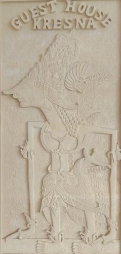 a carving of a wolf on a cake at Kresna Guest House Syariah Pacitan in Pacitan