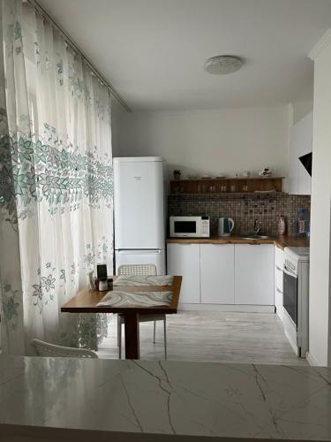 Kuchyň nebo kuchyňský kout v ubytování Apartament27