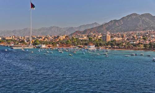 a group of boats in a large body of water at InterContinental Aqaba by IHG in Aqaba