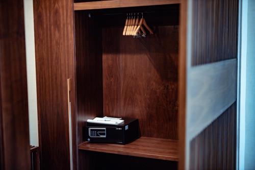 a radio sitting on a wooden shelf in a room at Muong Thanh Luxury Cao Bang in Cao Bằng
