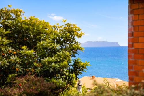 a view of the ocean from a house at Stunning Ocean View Perfect For Groups & Families in Cooee