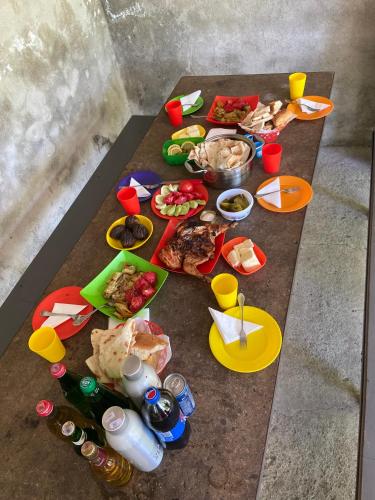 a table with food and drinks on top of it at Yeghevni Guest House in Odzun in Odzun