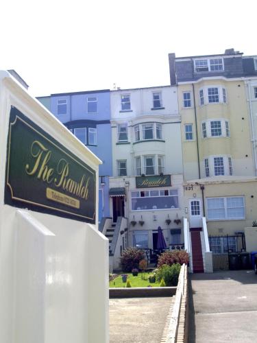 a sign in front of a large building at The Ramleh in Scarborough