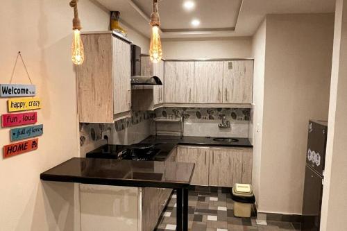 A kitchen or kitchenette at Mici hotel luxury Apartment's Lahore