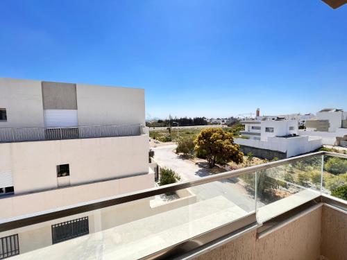 a view from the balcony of a building at Abilia Suite - À Proximité de l'Aéroport - Confort et Élégance in La Soukra