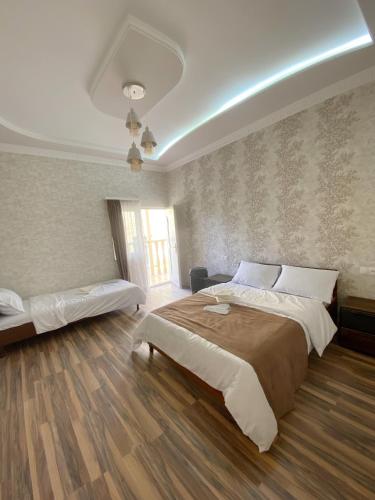 a bedroom with a large bed and a window at Yeghevni Guest House in Odzun in Odzun