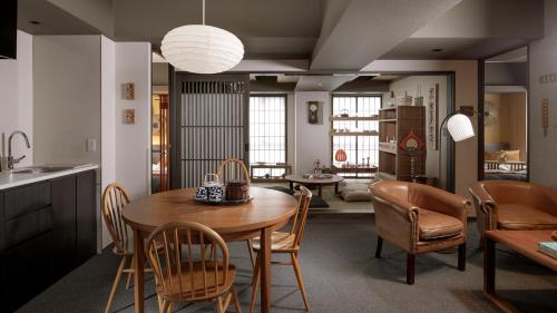 a kitchen and dining room with a table and chairs at MIMARU SUITES KYOTO CENTRAL in Kyoto