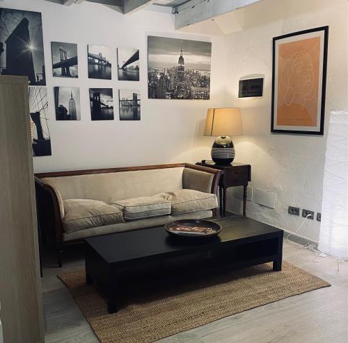 a living room with a couch and a coffee table at Orotava The Home - Vacational rental with the lifestyle of 1700 and the comfort of 2022 in La Orotava