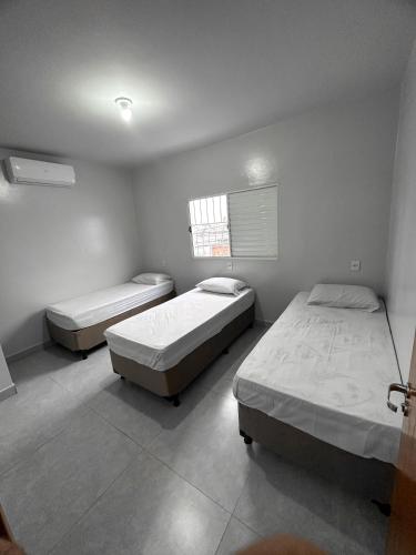 Cama o camas de una habitación en Spot Hotel e pousada