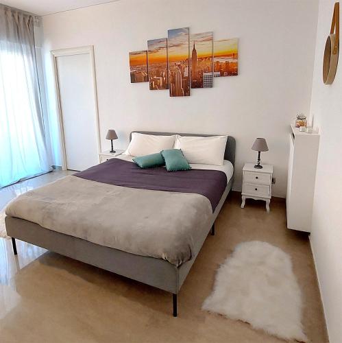 Un ou plusieurs lits dans un hébergement de l'établissement Stanza Vacanza Confortevole in appartamento ad un passo dal mare