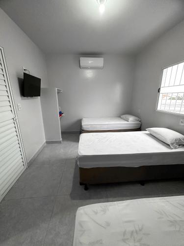 Ένα ή περισσότερα κρεβάτια σε δωμάτιο στο Spot Hotel e pousada