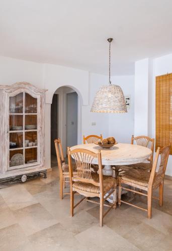 a dining room with a table and chairs at Sea View Apartment Albir Playa Mar in Albir