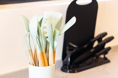 a white container filled with utensils on a counter at Urban Suites, Spectre Collection by Stellar ALV in Jelutong
