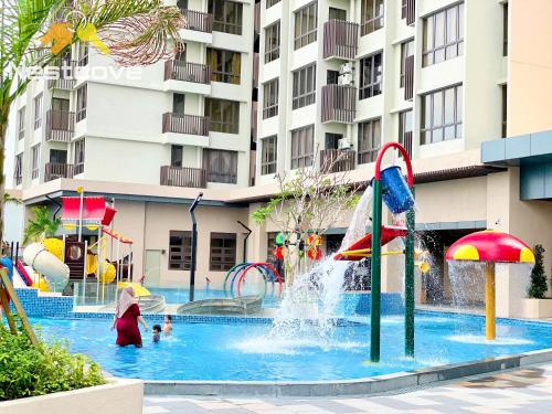a pool with a water park with a water slide at Mutiara Bali Residence Suites By Nestcove in Melaka