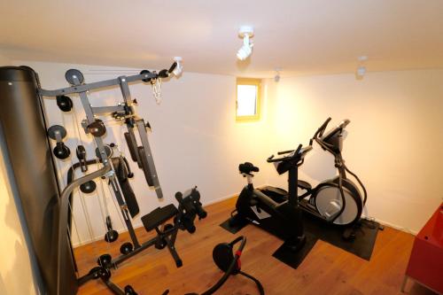 a gym with several exercise bikes in a room at Guarda Lodge in Guarda