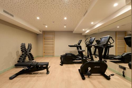 a gym with several exercise bikes in a room at Catalonia La Maquinista in Barcelona