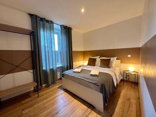 Ένα ή περισσότερα κρεβάτια σε δωμάτιο στο Limoges Sud-LesCinqSuites Le Saint Laurent-DABNB