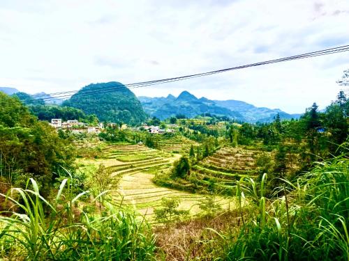 a view of rice terraces in the mountains at Bac Ha Lodge Retreat in Bắc Hà