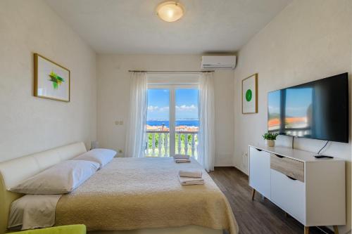 Postel nebo postele na pokoji v ubytování Apartman KALI