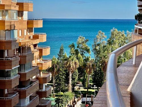 a view of the ocean from a balcony of a building at Apartamento Costa Marina II REF. 020 in El Borseral
