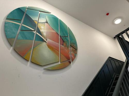 a large mirror hanging on a wall at Mary Mullen's Rooms Eyre Square. in Galway