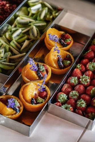 a display of fruit and vegetables in a display case at The Rebello Hotel & Spa - Small Luxury Hotels Of The World in Vila Nova de Gaia