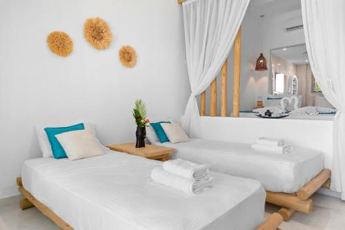 Postel nebo postele na pokoji v ubytování Alia Beachfront Suites and Spa