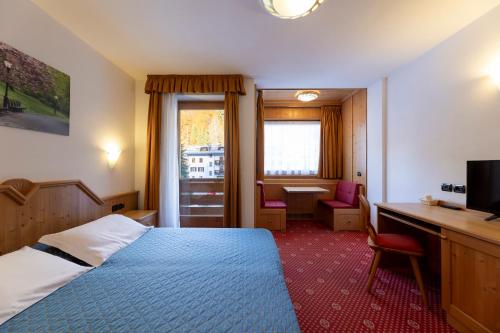Кровать или кровати в номере Sport Hotel Cristal