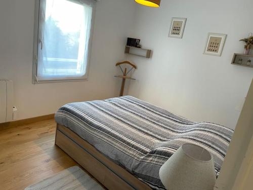Katil atau katil-katil dalam bilik di Appartement le Kingsbridge