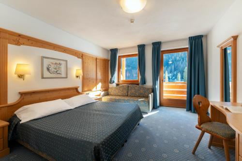 Кровать или кровати в номере Sport Hotel Cristal