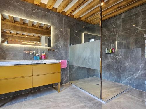 a bathroom with a shower and a yellow sink at Villa d'exception, 5 chambres, 20m plage, spa. in Bénerville-sur-Mer