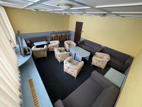 an overhead view of a waiting room with couches and tables at Harrachov 624 in Harrachov
