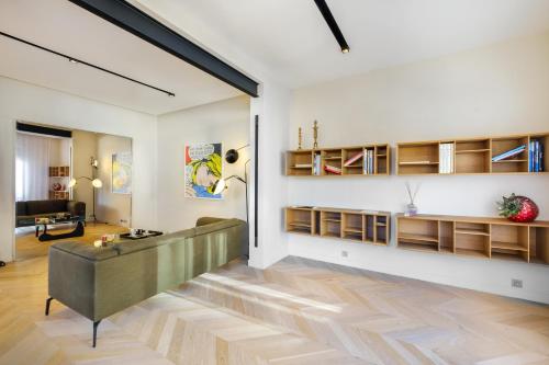 a living room with a couch and a table at Appartement de luxe - Bluesky in Beausoleil