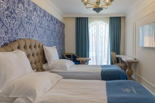 ECO Therma Village - All inclusive & Private Beach & Free Parkingにあるベッド