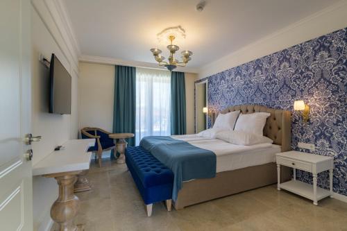 ECO Therma Village - All inclusive & Private Beach & Free Parkingにあるベッド