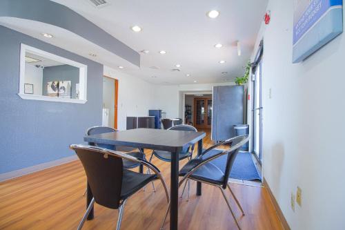 a dining room with a table and chairs at Studio Inn Extended Stay Oklahoma City Airport by OYO in Oklahoma City