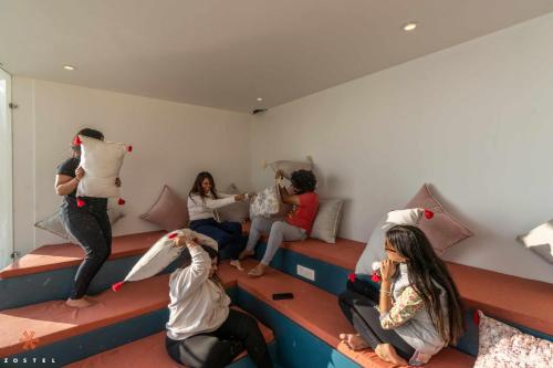 a group of people sitting in a room at Zostel Mussoorie (Mall Road) in Mussoorie